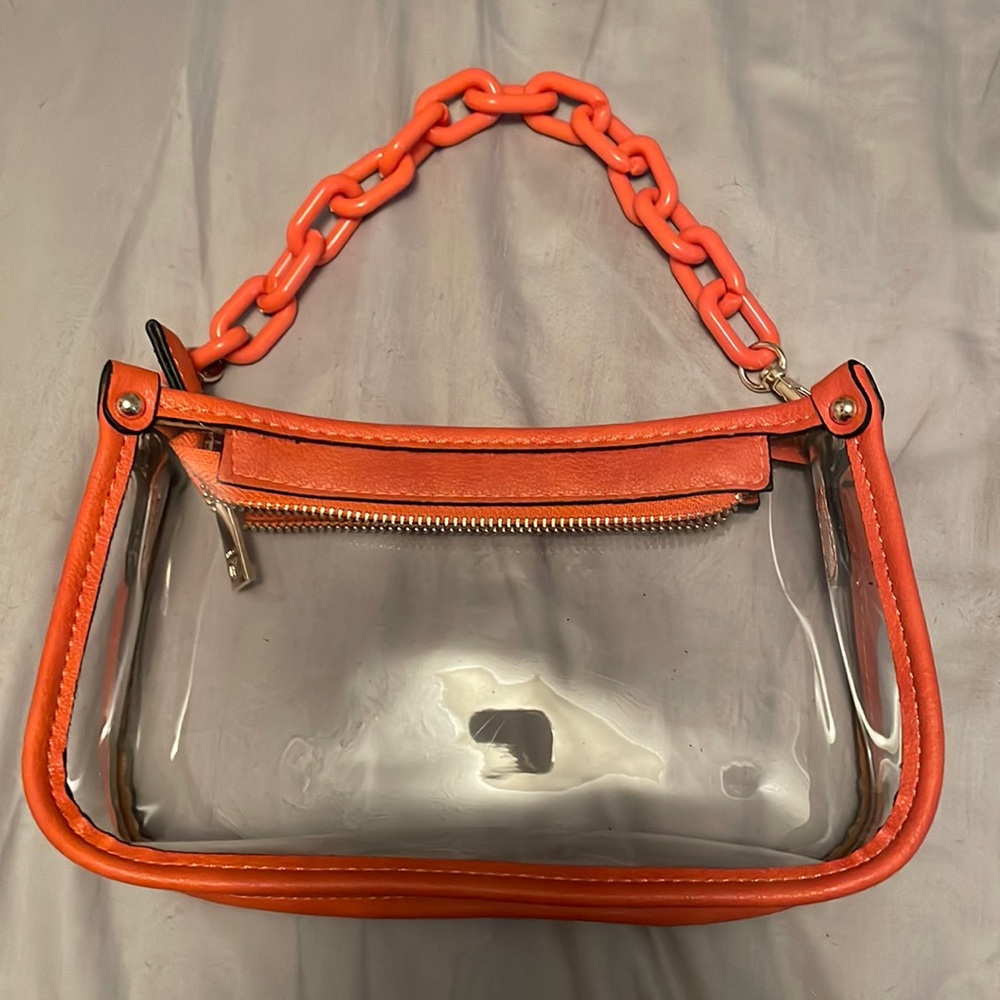 Burnt orange purse. With straps.